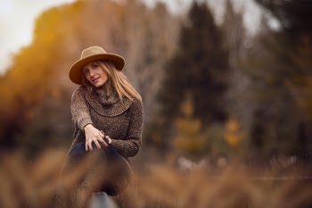 Portrait of Woman Sitting on Stone