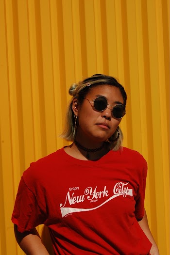 Portrait of Woman Wearing a Red Crew-neck T-shirt and Sunglasses