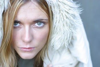 Portrait of woman wearing a white fur hoodie