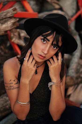 Portrait of Woman Wearing Black Dress and Black Cowboy Hat