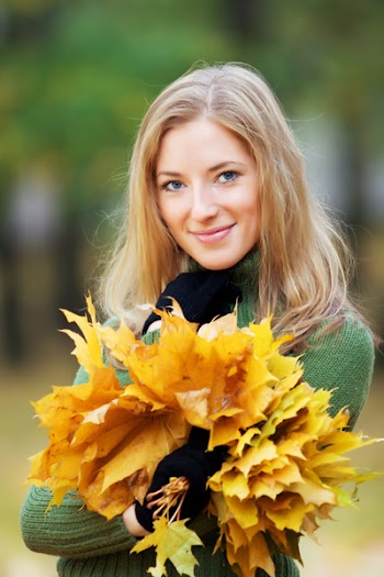 portrait of young woman in autumnal park