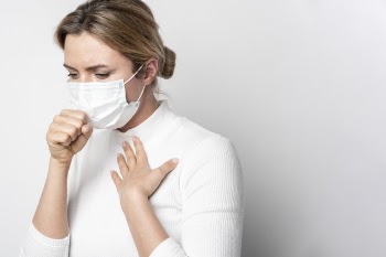 Portrait of young woman with surgical mask Free Photo
