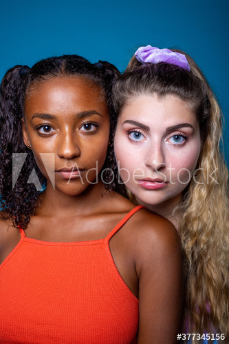 Portrait of young women standing indoors