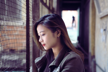 Portrait photo of a Woman Wearing a gray jacket
