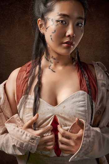Portrait Photo of Asian Woman with Face Markings