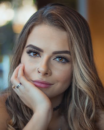 Portrait Photo of Beautiful Woman With Her Hand on Her Cheek