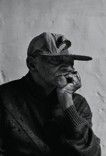Portrait Photo of Elderly Man Leaning Chin on his Hand Palm