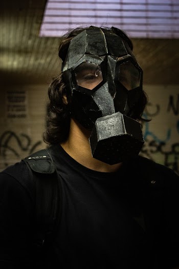 Portrait Photo of Man in Black Gas Mask