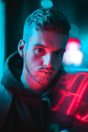 Portrait Photo of Man Wearing Black Pullover Hoodie
