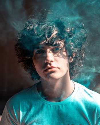 Portrait Photo of Man With Curly Hair