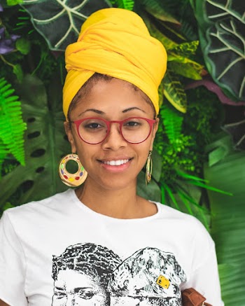 Portrait Photo of Smiling Woman in Yellow Headscarf and White T-shirt Posing