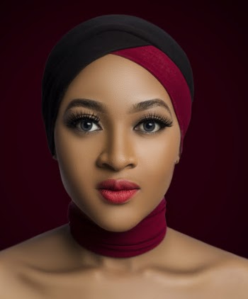 Portrait Photo of Topless Woman in Maroon and Black Headscarf and Maroon Fabric Choker