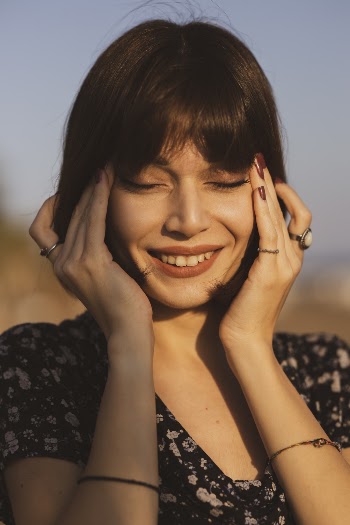 Portrait Photo Of Woman Holding Her Face