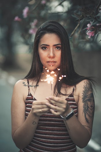 Portrait Photo of Woman Holding Lit Sparkler