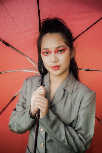 Portrait Photo of Woman Holding Umbrella