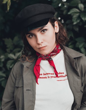 Portrait Photo of Woman in Black Hat and Neck Scarf