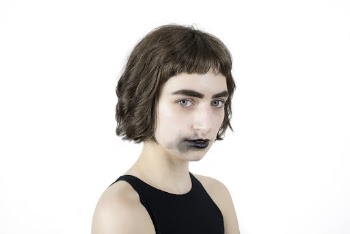 Portrait Photo of Woman in Black Sleeveless Top With Smudged Black Lipstick