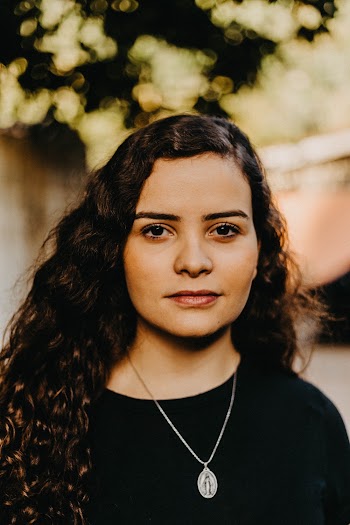 Portrait Photo of Woman in Black T-shirt Posing