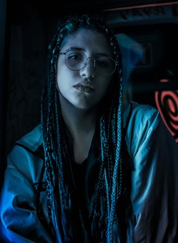 Portrait Photo of Woman in Gray Jacket Wearing Eyeglasses With Black Frames