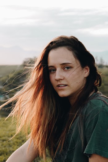 Portrait Photo of Woman in Green T-shirt Posing