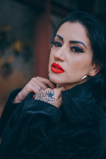 Portrait Photo of Woman in Make-up Black Coat Posing