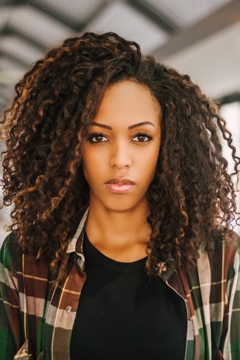 Portrait Photo of Woman in Plaid Shirt and Black T-shirt