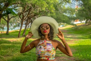Portrait Photo of Woman in Sun Hat, Crop Top, and Sunglasses Posing