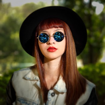 Portrait Photo of Woman in Sunglasses and Black Hat