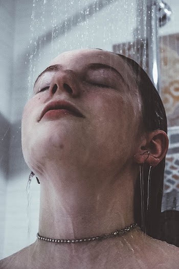 Portrait Photo of Woman on Shower