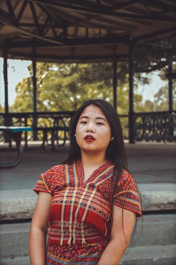 Portrait Photo of Woman Standing Outside the Gazebo Posing