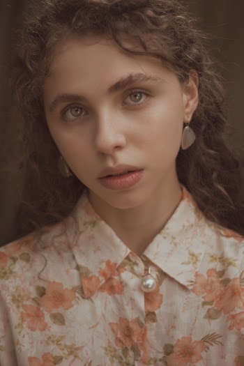 Portrait Photo of Woman Wearing Floral Top