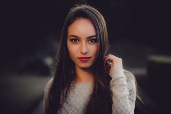 Portrait Photo of Woman Wearing Gray Long-Sleeved Top