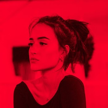 portrait photograph of woman in black shirt
