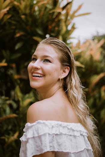Portrait Photograph of Woman in White Off-shoulder Top
