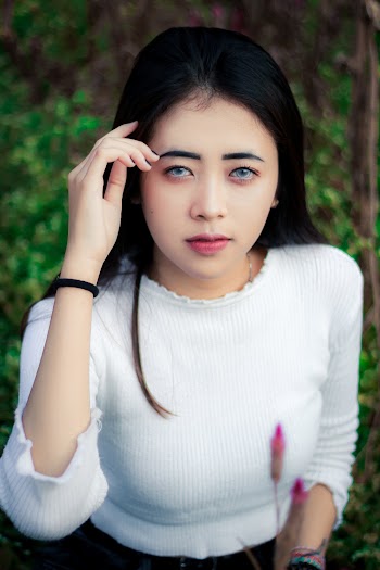 Portrait Photography of a Woman Wearing White Long-sleeved Shirt 