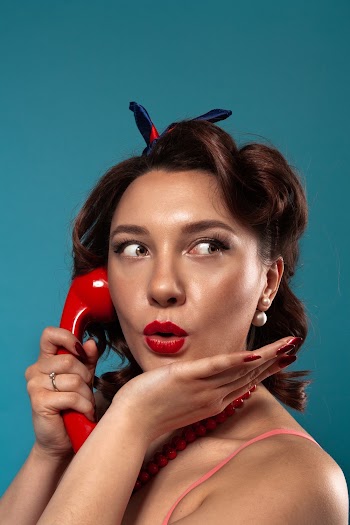 Portrait Photography of Woman Answering a Telephone