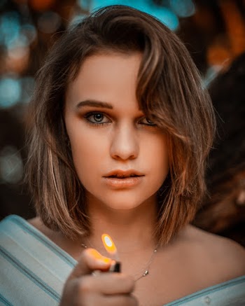 Portrait Photography of Woman Holding Lighter