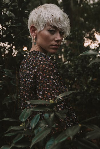 Portrait Photography of Woman Surrounded by Plants