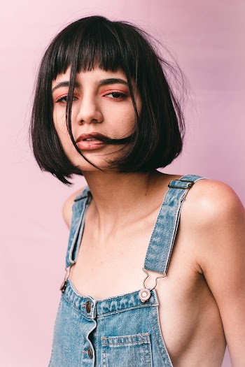 Portrait Photography of Woman Wearing Blue Denim Bib-and-brace Top