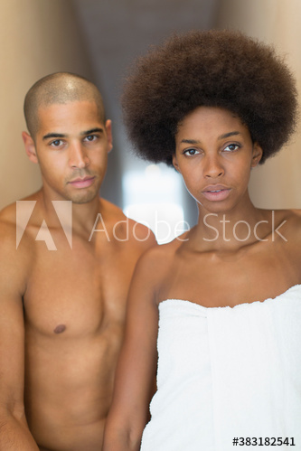 Portrait serious attractive young couple in bathroom