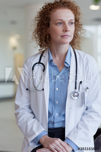 Portrait serious female doctor looking away