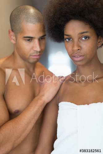 Portrait serious young couple in bathroom