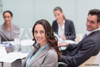 Portrait smiling business people in conference room meeting