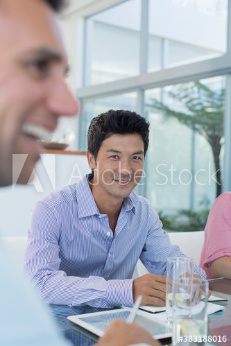Portrait smiling businessman in meeting