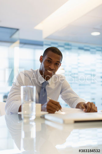 Portrait smiling businessman working in office
