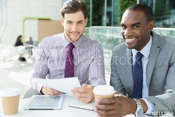 Portrait smiling businessmen meeting at cafe