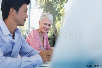 Portrait smiling businesswoman in meeting