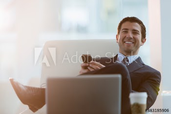 Portrait smiling corporate businessman with smart phone