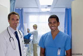 Portrait smiling male doctors making rounds in hospital