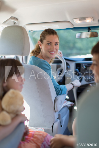 Portrait smiling mother in car with children